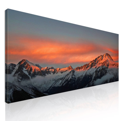 Quadro Montagne Catena Montuosa Innevata Al Tramonto Con Nuvole Arancioni Luminose  mow28 quadro stampato su tela